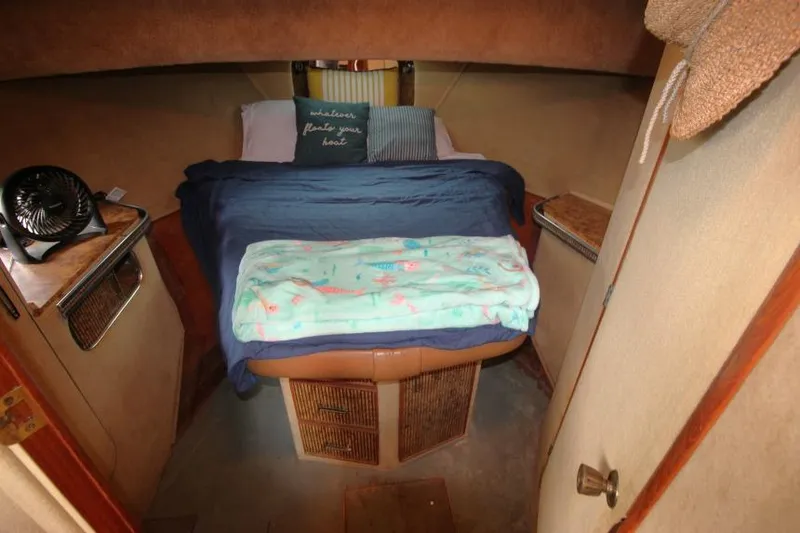 Slide: The Image of Cozy cabin interior of 1983 Chris-Craft 350 Catalina with bed and decor. - 24