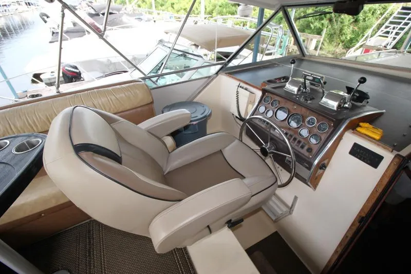 Slide: The Image of 1983 Chris-Craft 350 Catalina helm with leather captain's chair and classic instrument panel. - 6