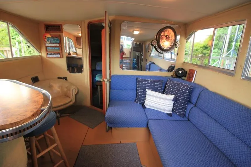 Slide: The Image of Interior of 1983 Chris-Craft 350 Catalina with blue seating and nautical decor. - 9