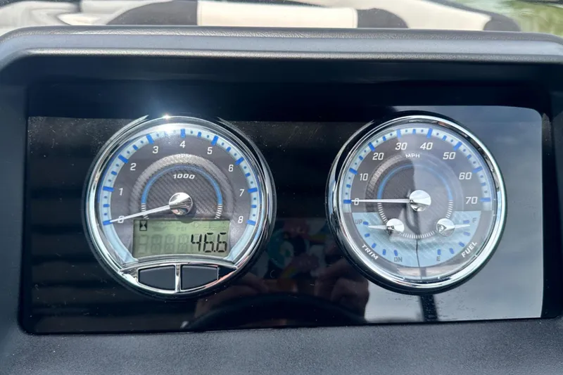 Slide: The Image of Dashboard of 2025 Tahoe 2785 showing RPM and speed gauges. - 11