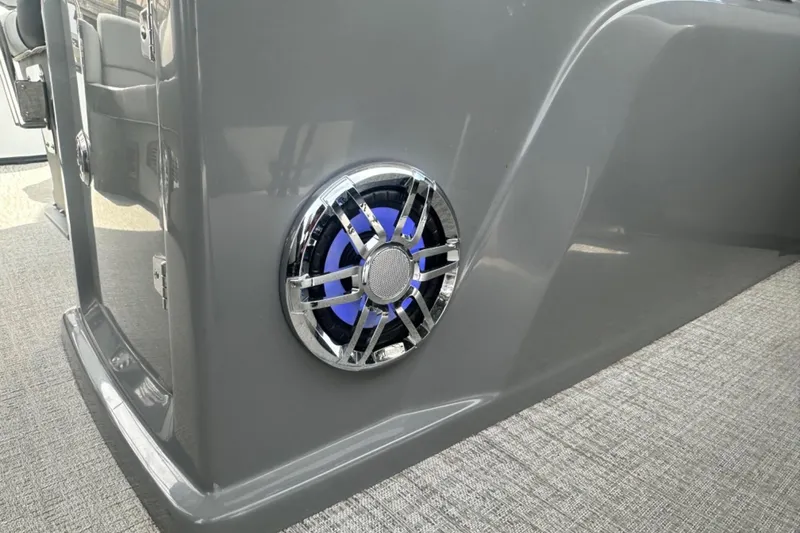 Slide: The Image of 2025 Tahoe 2785 boat interior with sleek gray panel and modern speaker design. - 12