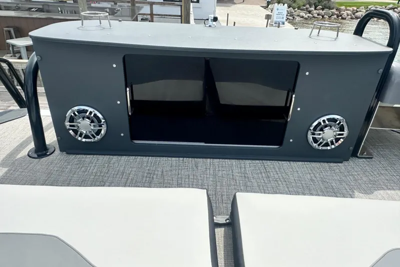 Slide: The Image of 2025 Tahoe 2785 boat interior with speakers and seating area. - 20