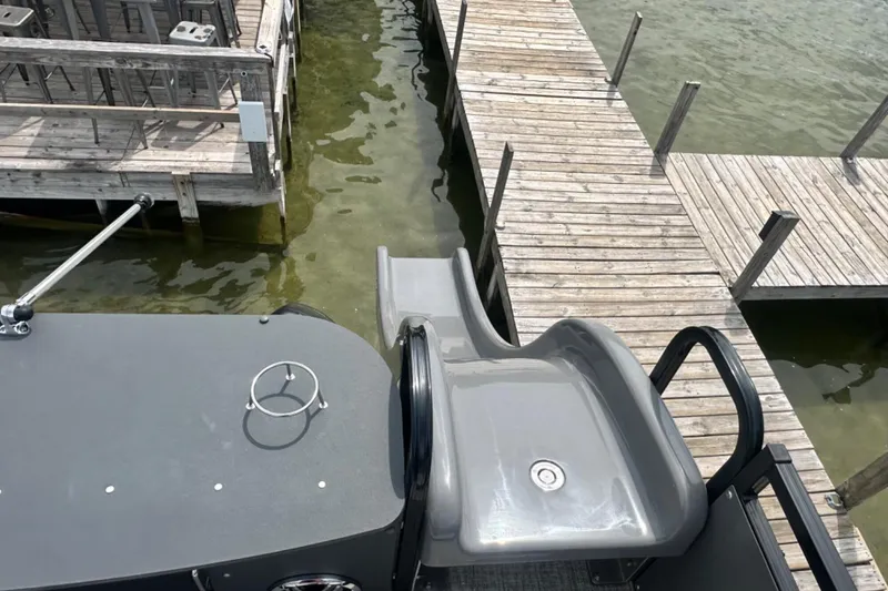 Slide: The Image of Pontoon boat with slide near wooden dock, Tahoe 2785, 2025 model. - 21