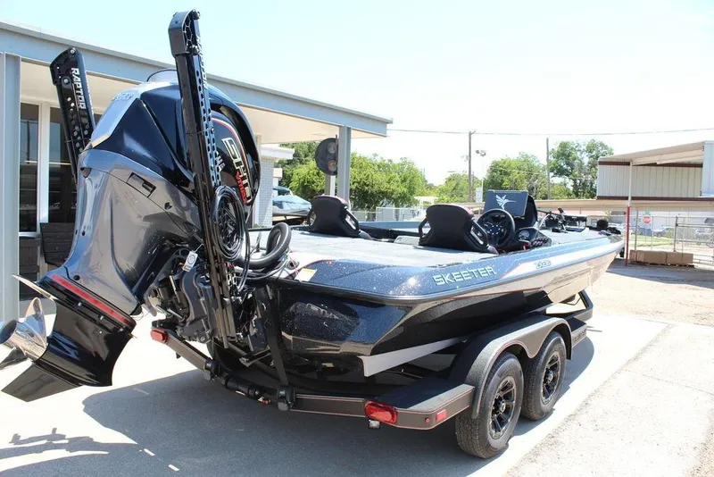 Slide: The Image of 2026 Skeeter ZXE21 boat on trailer, featuring powerful outboard motor. - 11