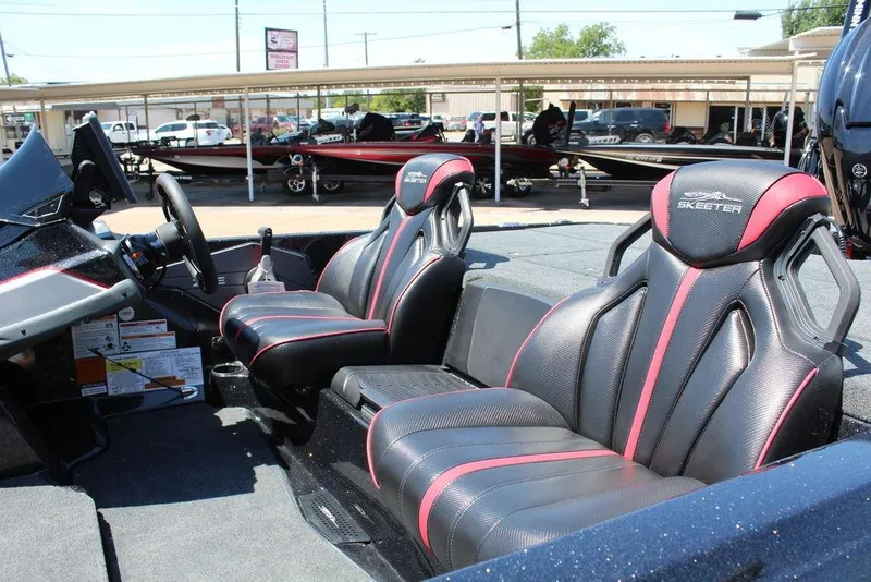 Slide: The Image of 2026 Skeeter ZXE21 boat interior with sleek black and red seats. - 12