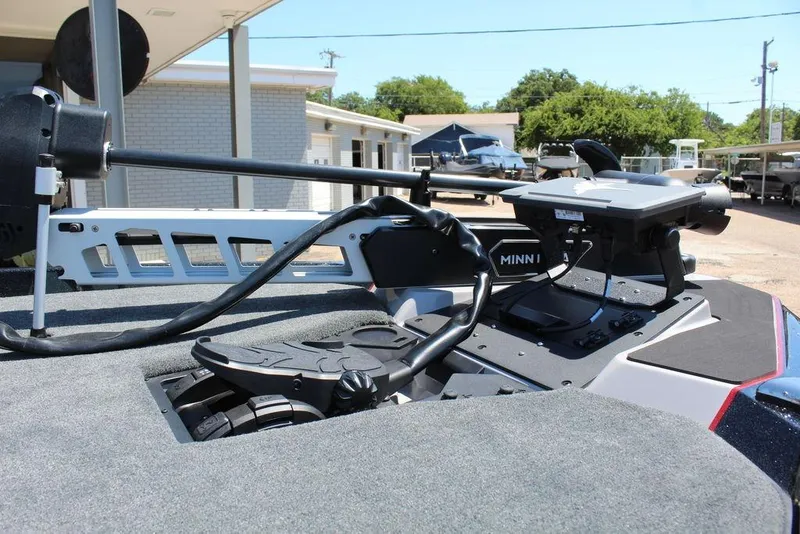Slide: The Image of 2026 Skeeter ZXE21 boat deck with Minn Kota trolling motor and control panel. - 13