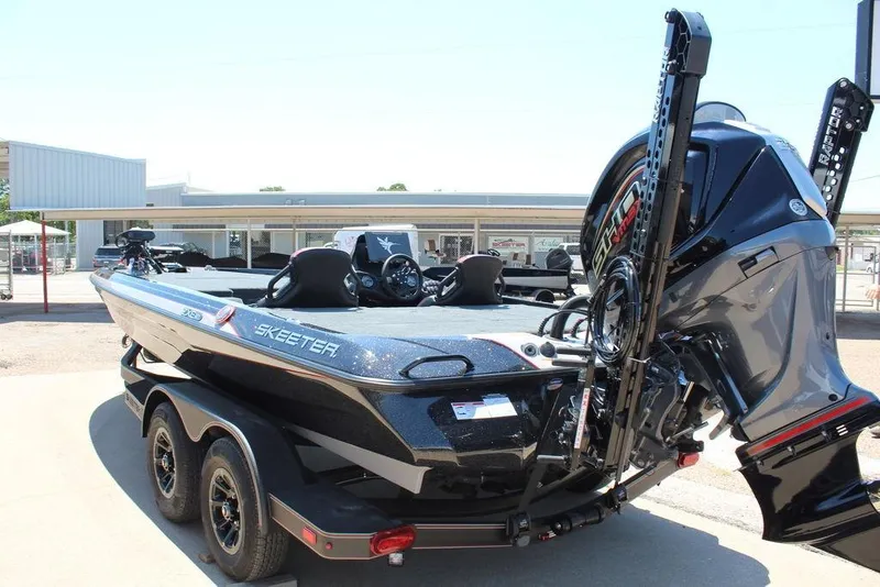 Slide: The Image of 2026 Skeeter ZXE21 boat with powerful engine and sleek design on a trailer. - 4