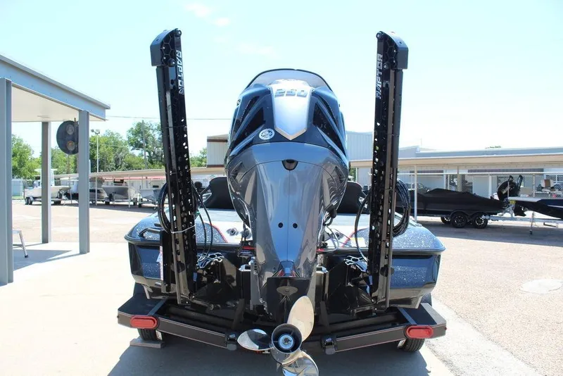 Slide: The Image of 2026 Skeeter ZXE21 boat rear view with powerful outboard motor and dual power poles. - 9