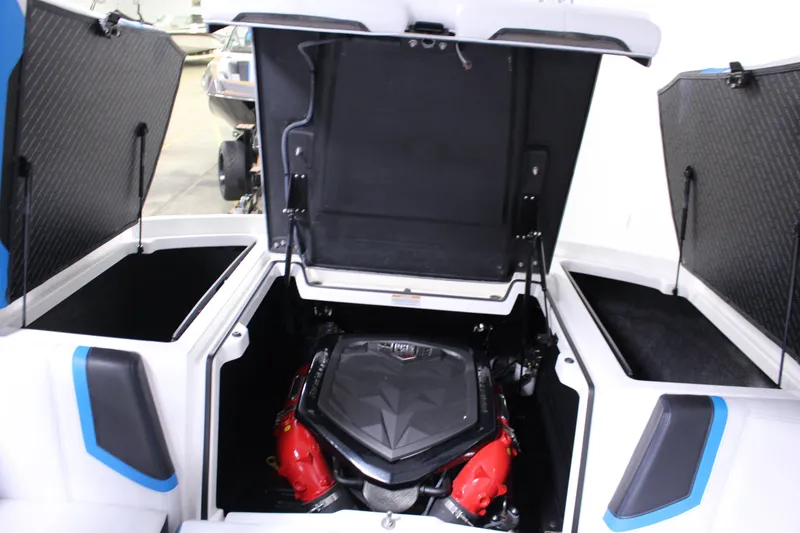 Slide: The Image of 2019 Nautique Super Air Nautique G23 engine compartment with open hatches, showcasing powerful engine. - 10