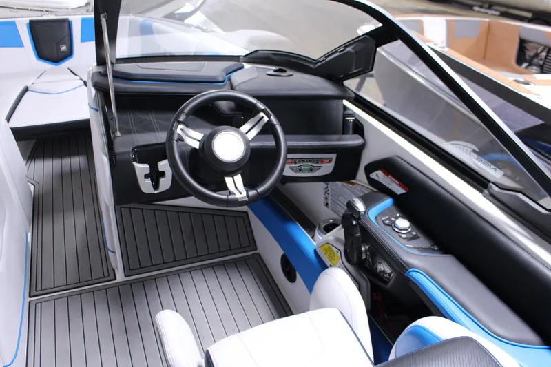 Slide: The Image of 2019 Nautique Super Air Nautique G23 boat interior with sleek steering and modern controls. - 3