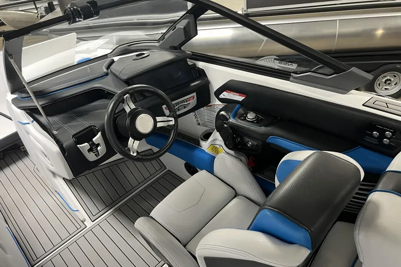 Slide: The Image of 2019 Nautique Super Air Nautique G23 interior with modern dashboard and steering wheel. - 5