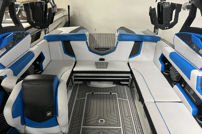 Slide: The Image of 2019 Nautique Super Air Nautique G23 interior with blue and white seating, modern design. - 8
