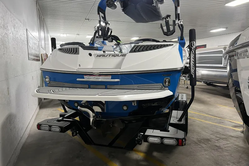 Slide: The Image of 2019 Nautique Super Air Nautique G23 boat in a storage facility. - 9