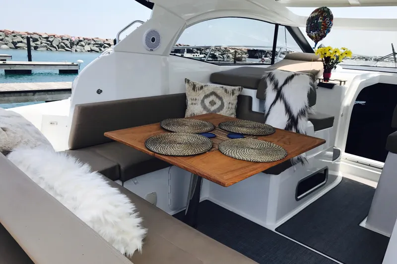 Slide: The Image of Luxurious 2016 Jeanneau Leader 36 yacht interior with elegant seating and decorative accents. - 11