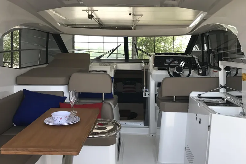 Slide: The Image of Interior of 2016 Jeanneau Leader 36 yacht with modern seating and dining area. - 19