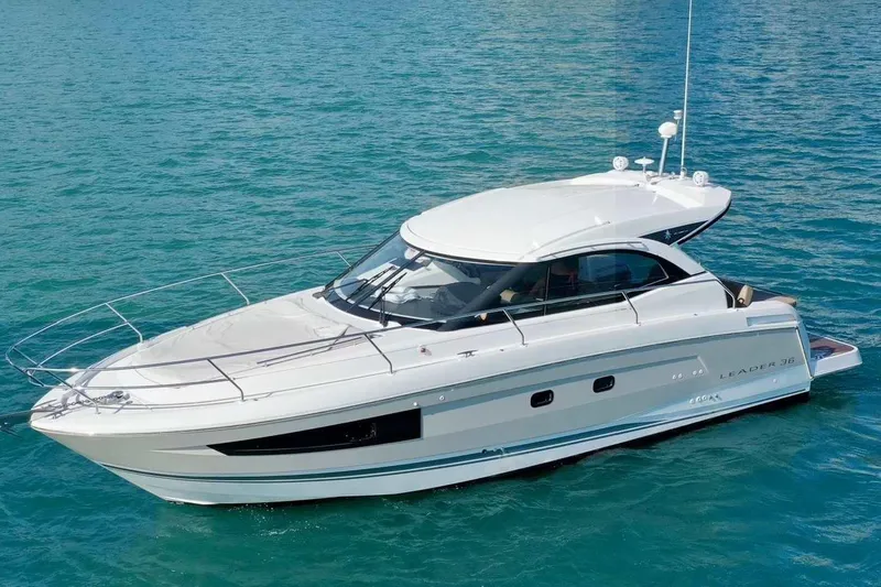 Slide: The Image of 2016 Jeanneau Leader 36 yacht on clear blue water. - 2