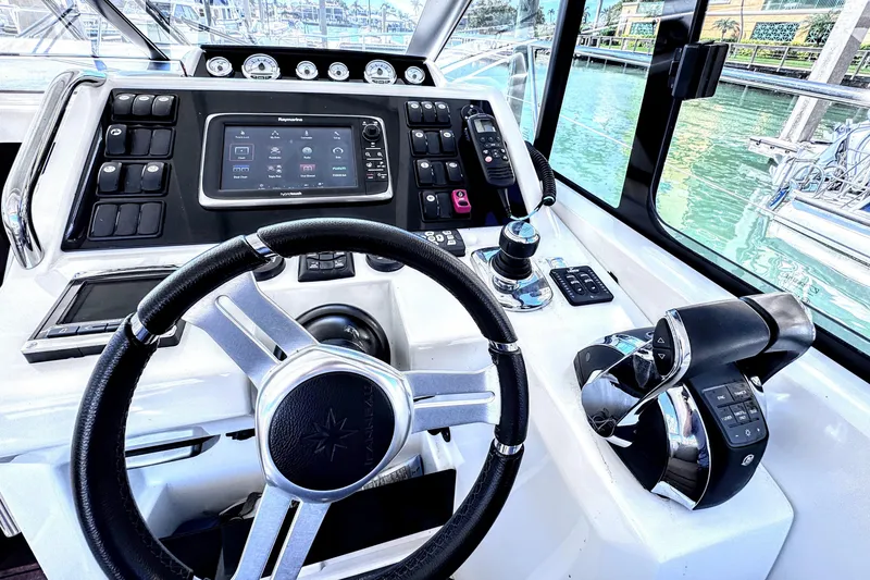 Slide: The Image of Helm of 2016 Jeanneau Leader 36 yacht with modern controls and navigation system. - 20