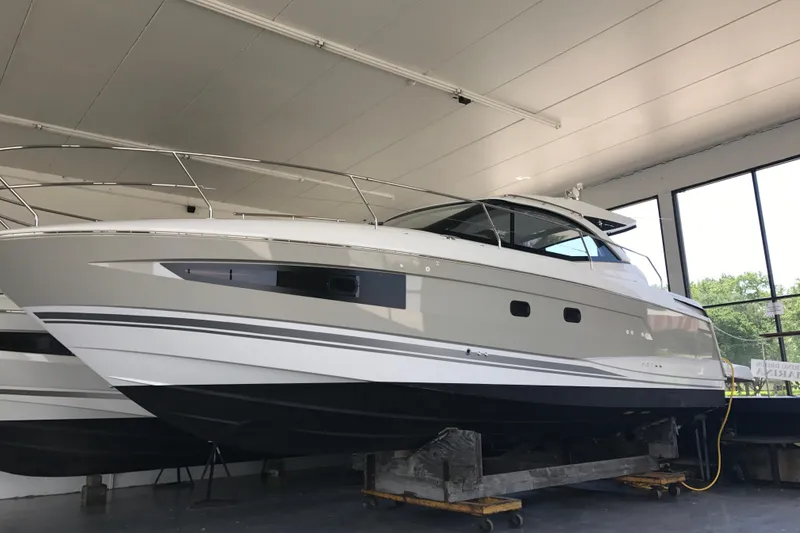 Slide: The Image of 2016 Jeanneau Leader 36 yacht in indoor storage, showcasing sleek design and modern features. - 21