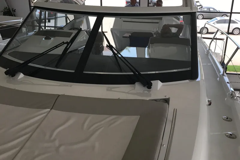 Slide: The Image of 2016 Jeanneau Leader 36 boat with sleek windshield and spacious deck area. - 22