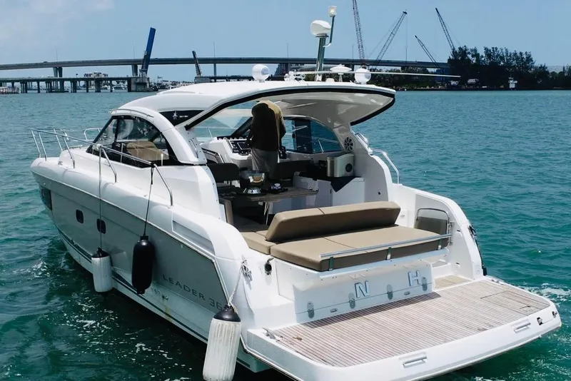 Slide: The Image of 2016 Jeanneau Leader 36 yacht cruising on blue water near a bridge. - 5