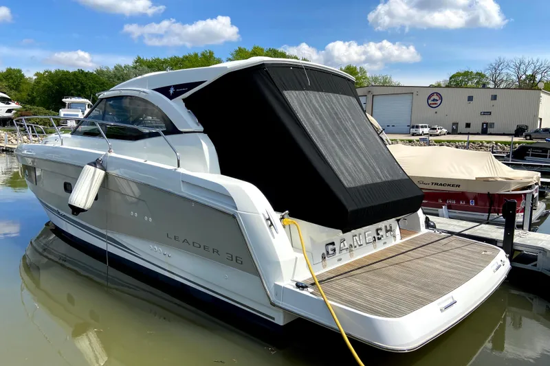 Slide: The Image of 2016 Jeanneau Leader 36 yacht docked at marina under blue sky. - 8
