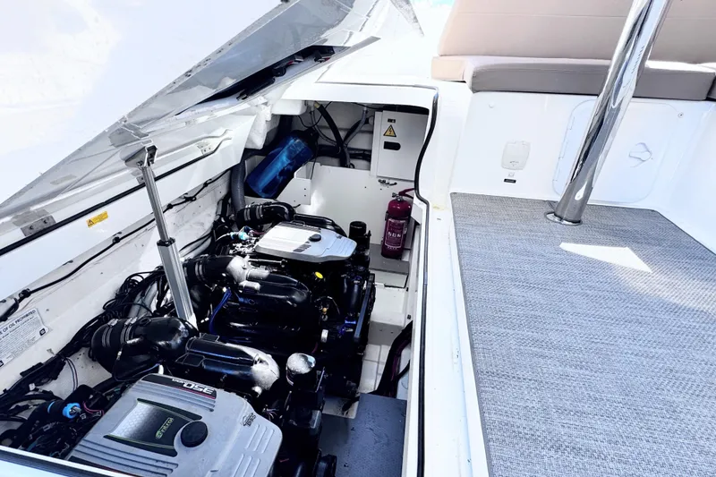 Slide: The Image of Engine compartment of 2016 Jeanneau Leader 36 boat, showcasing dual engines and clean layout. - 9