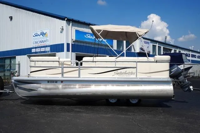 Slide: The Image of 2007 Godfrey 200 Sweetwater pontoon boat parked outside dealership. - 1