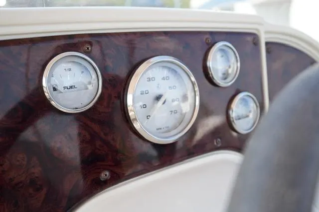 Slide: The Image of Dashboard of 2007 Godfrey 200 Sweetwater boat with fuel and speed gauges. - 11