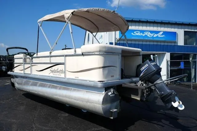 Slide: The Image of 2007 Godfrey 200 Sweetwater pontoon boat with Yamaha motor, parked outside dealership. - 7