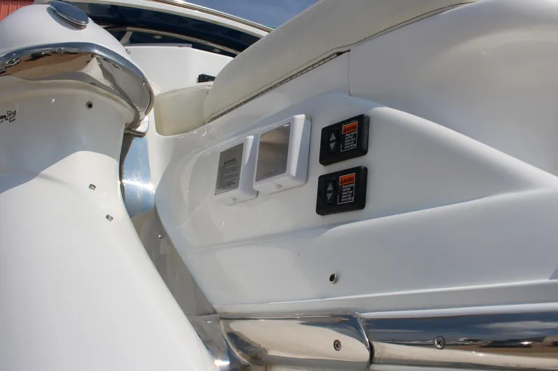 Slide: The Image of 2018 Cobalt R35 boat interior with control panels and seating detail. - 16