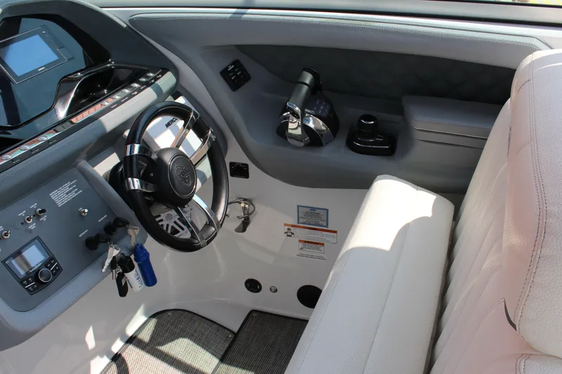 Slide: The Image of Cockpit of 2018 Cobalt R35 Surf boat with steering wheel and control panel. - 3