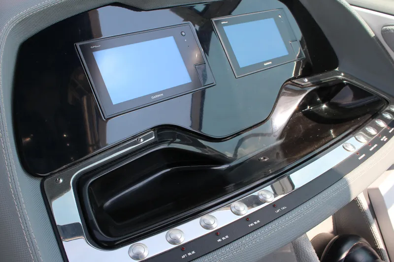 Slide: The Image of 2018 Cobalt R35 dashboard with dual Garmin screens and control buttons. - 34