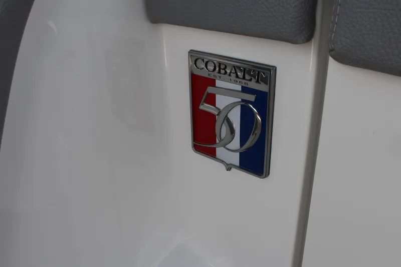 Slide: The Image of 2018 Cobalt R35 50th anniversary emblem on white surface. - 38