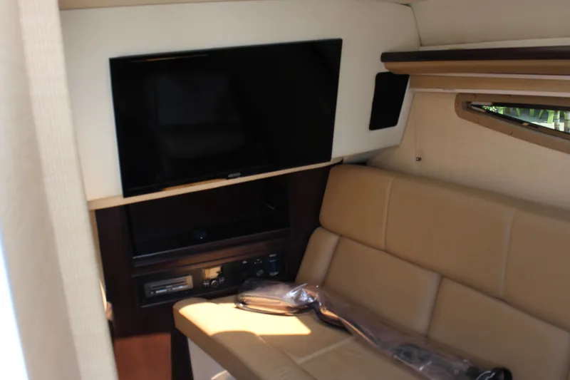 Slide: The Image of Interior of 2018 Cobalt R35 boat with TV and beige seating. - 39
