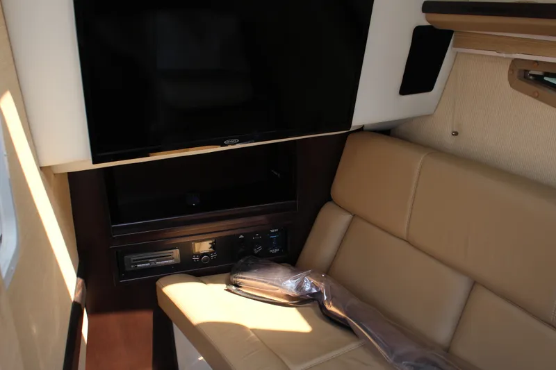 Slide: The Image of 2018 Cobalt R35 interior with beige seating and entertainment system. - 41