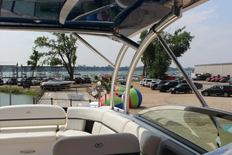 Slide: The Image of 2018 Cobalt R35 boat interior with marina view and parked cars. - 44