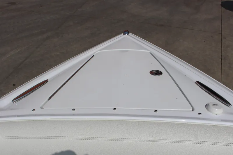 Slide: The Image of Bow of 2018 Cobalt R35 boat with sleek white design and chrome accents. - 50