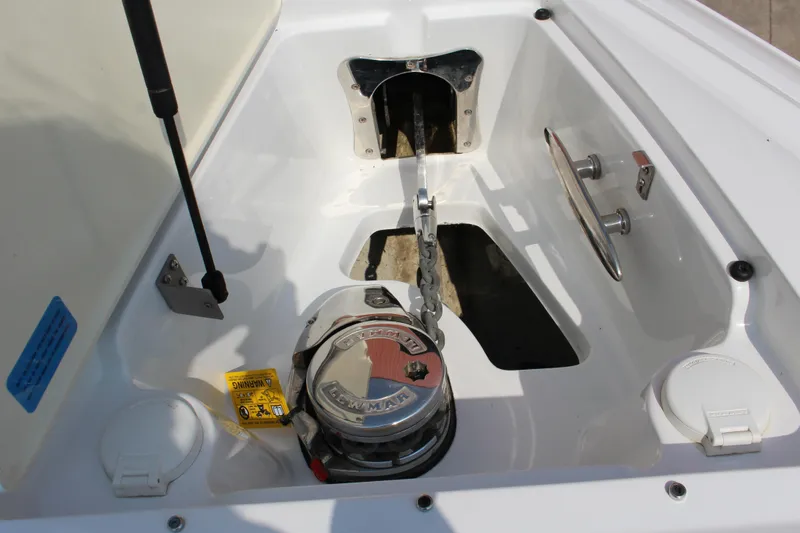 Slide: The Image of 2018 Cobalt R35 boat anchor compartment with winch and cleat. - 51