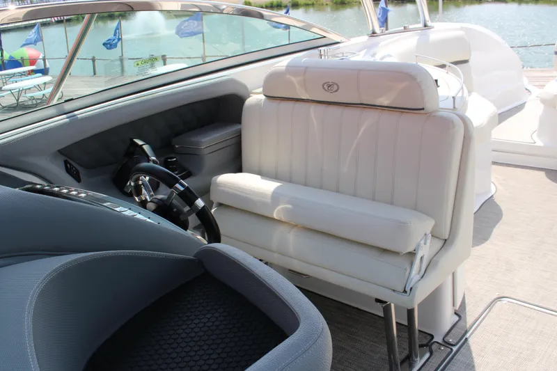Slide: The Image of Interior of 2018 Cobalt R35 boat with white leather seating and steering wheel. - 55