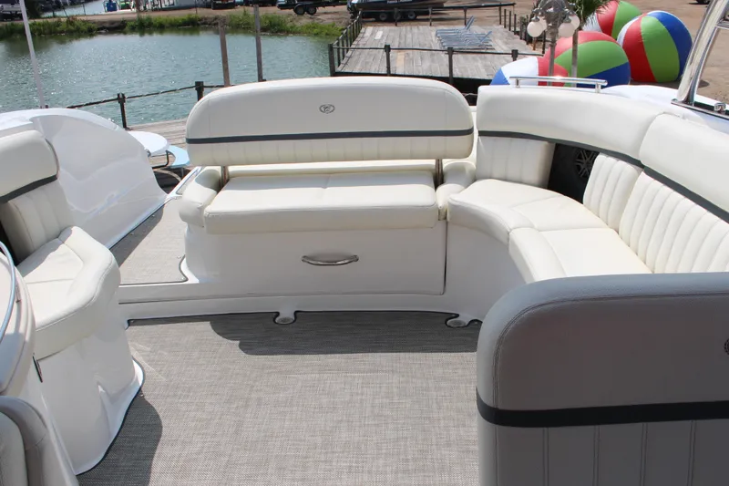 Slide: The Image of Luxurious seating area on a 2018 Cobalt R35 boat, docked by a serene lake. - 56
