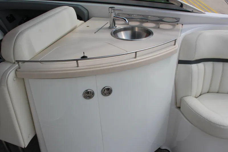Slide: The Image of 2018 Cobalt R35 Surf boat interior with sink and seating area. - 8