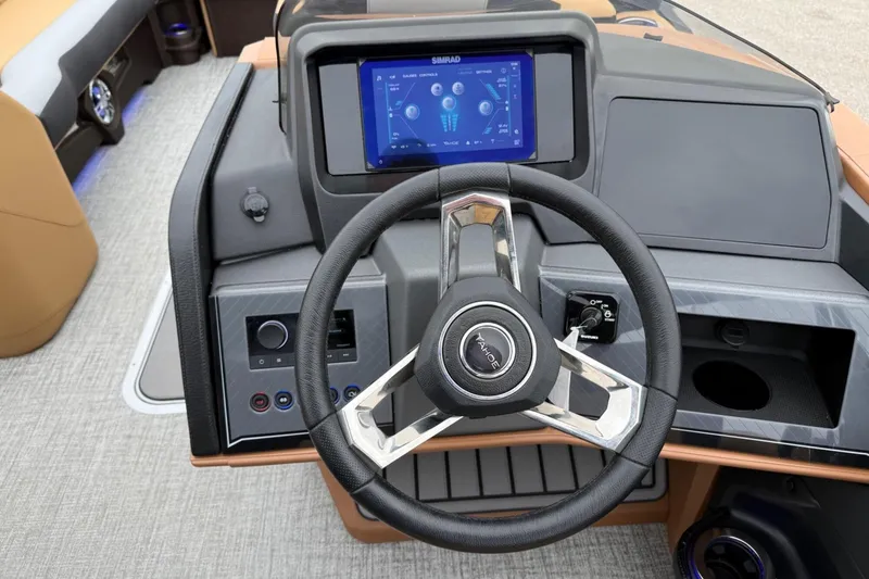 Slide: The Image of Steering wheel and dashboard of 2025 Tahoe 2785 boat with touchscreen display. - 14