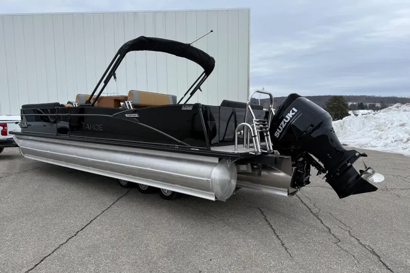 Slide: The Image of 2025 Tahoe 2785 pontoon boat with Suzuki outboard motor on a snowy day. - 3