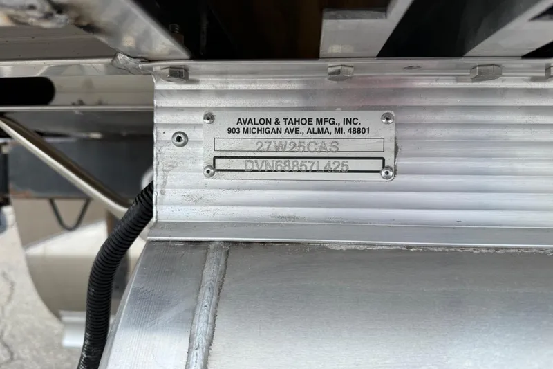 Slide: The Image of Metal identification plate on a 2025 Tahoe 2785, showing manufacturer details and serial numbers. - 9