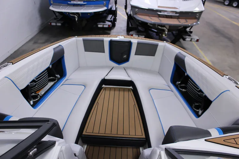 Slide: The Image of 2018 Nautique Super Air Nautique G25 interior with white seating and blue accents. - 3