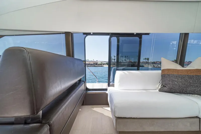Slide: The Image of Interior of 2019 Prestige 520 yacht with modern seating and ocean view. - 11