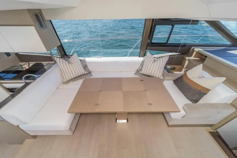Slide: The Image of Luxurious interior of 2019 Prestige 520 yacht with elegant seating and ocean view. - 12