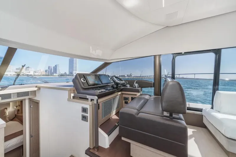 Slide: The Image of Luxurious interior of 2019 Prestige 520 yacht with city skyline view. - 14