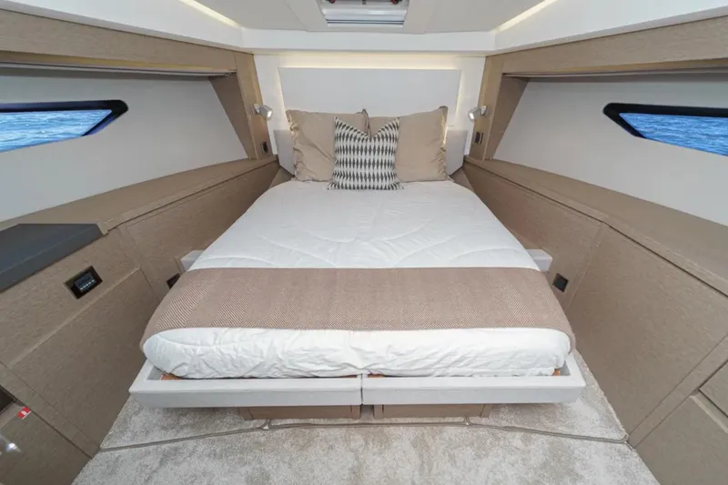 Slide: The Image of Luxurious bedroom interior of 2019 Prestige 520 yacht with elegant bedding and modern design. - 17