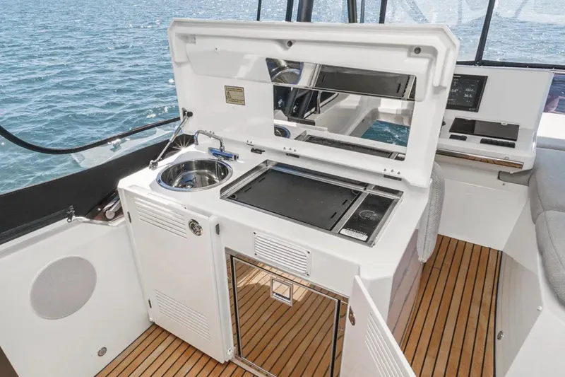 Slide: The Image of Prestige 520 yacht's outdoor kitchen with sink and grill, 2019 model. - 28